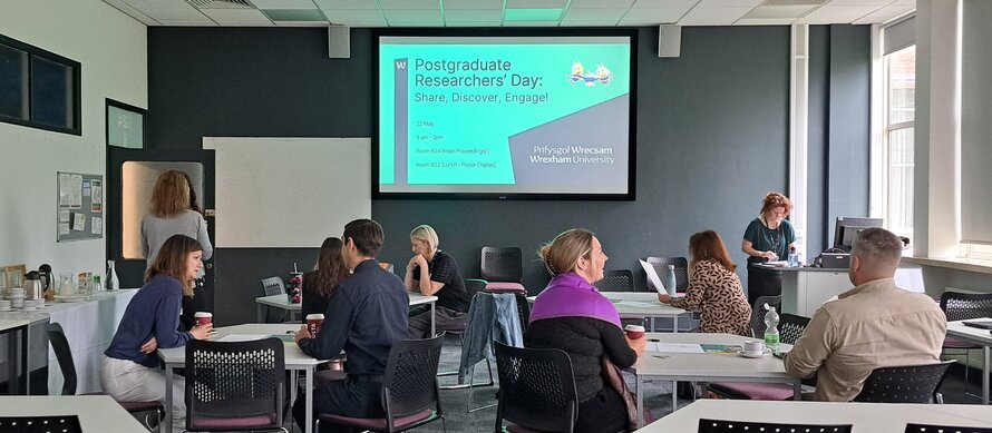 attendees sitting at tables PGR day 25