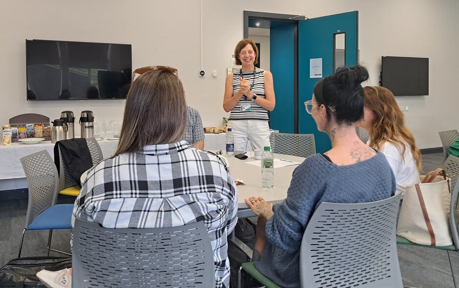 Mandy introducing the session with students sitting at a table