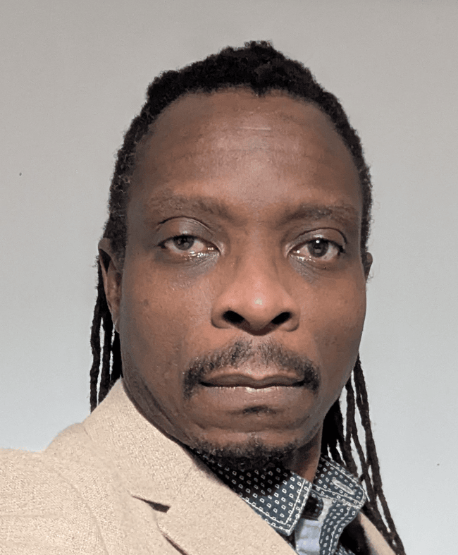 Head shot of research wearing a cream blazer
