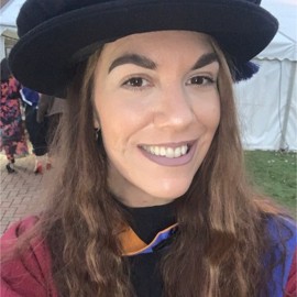 Chelsea selfie smiling with doctoral graduation cap