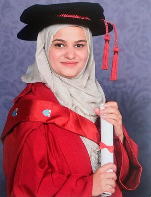 saba in graduation gown and hat