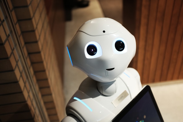 a white robot that appears to be looking up and smiling