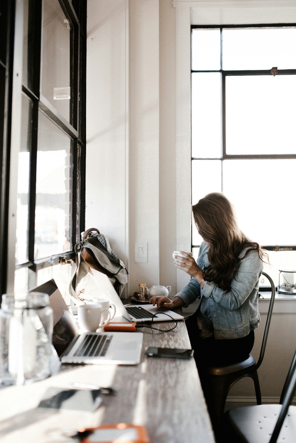 person sitting writing