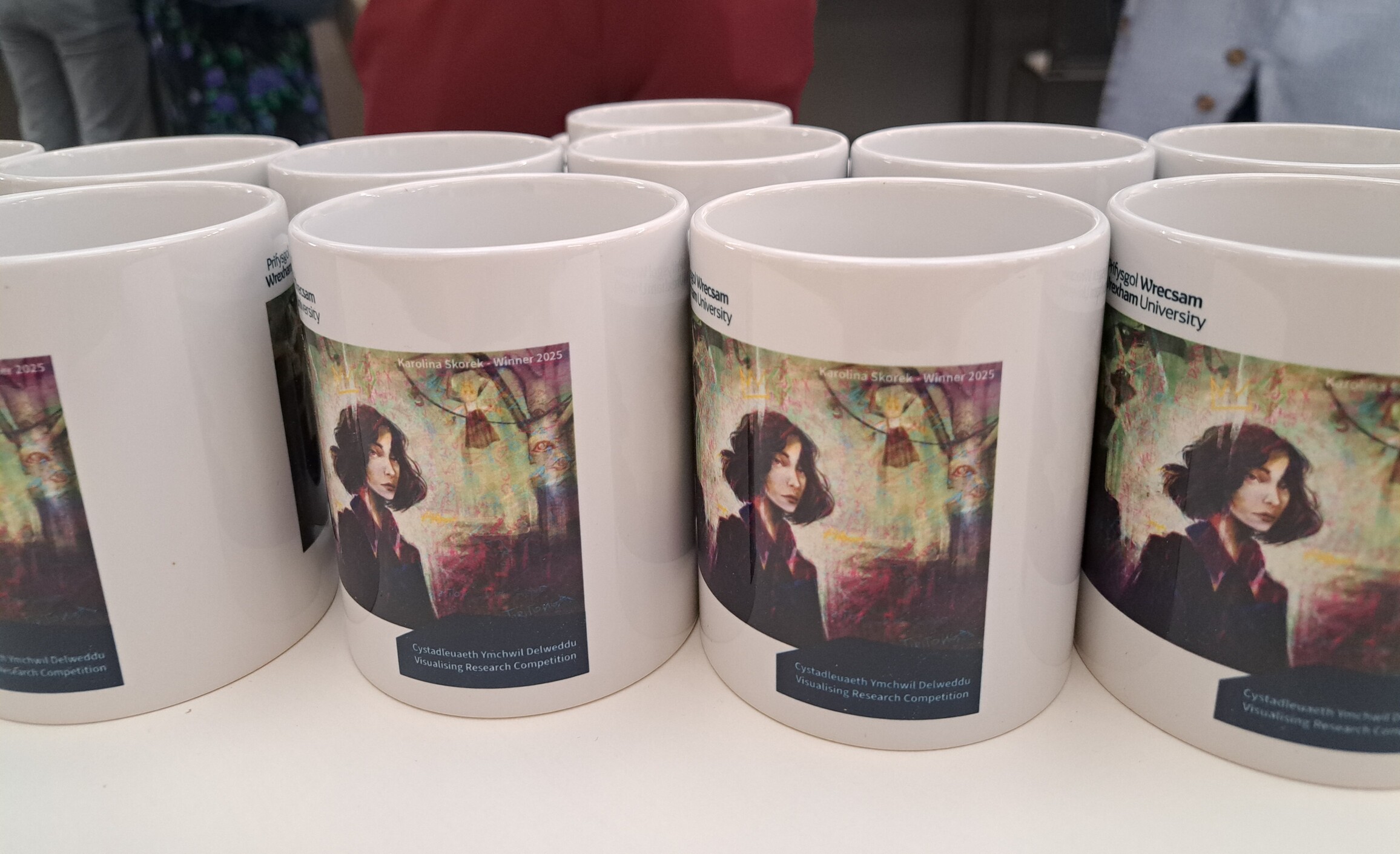close up of mugs with an image printed on them