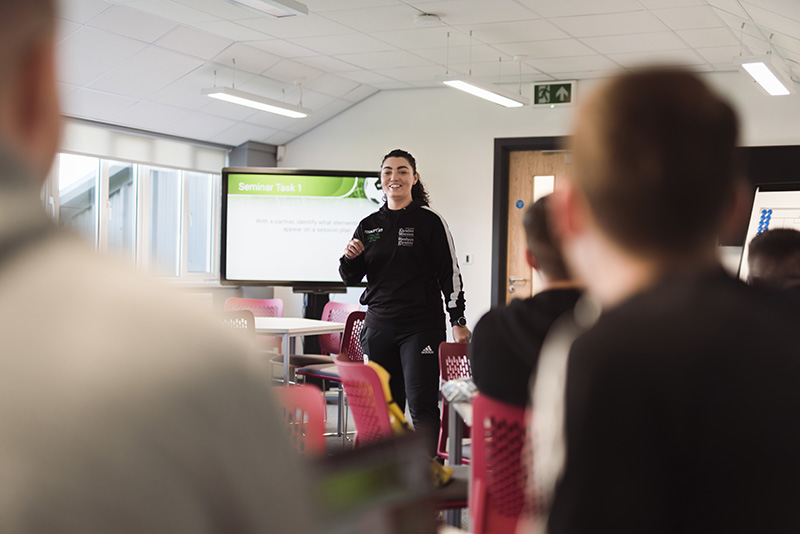 Students in a football coaching lecture