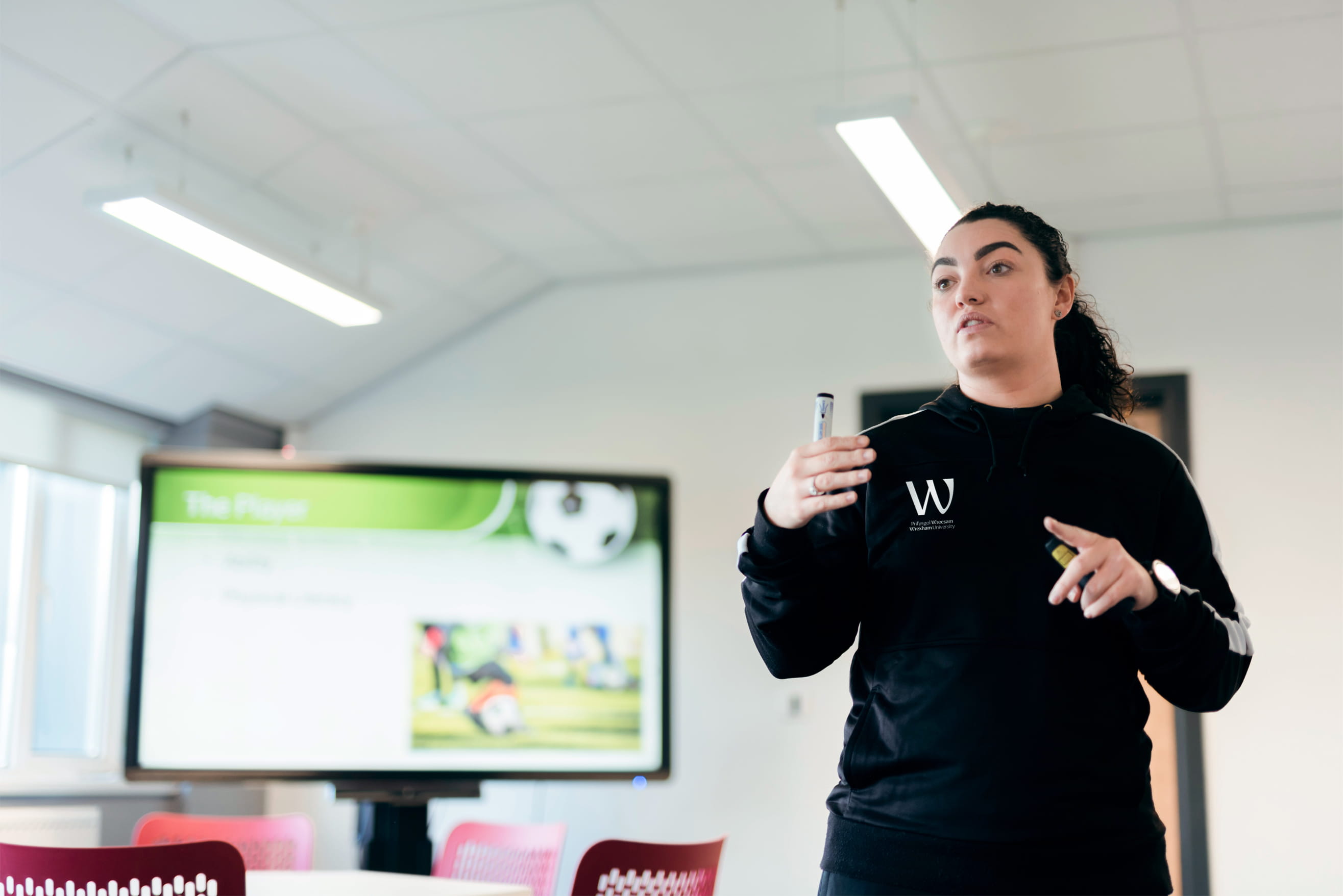 ports Business Management lecturer in classroom