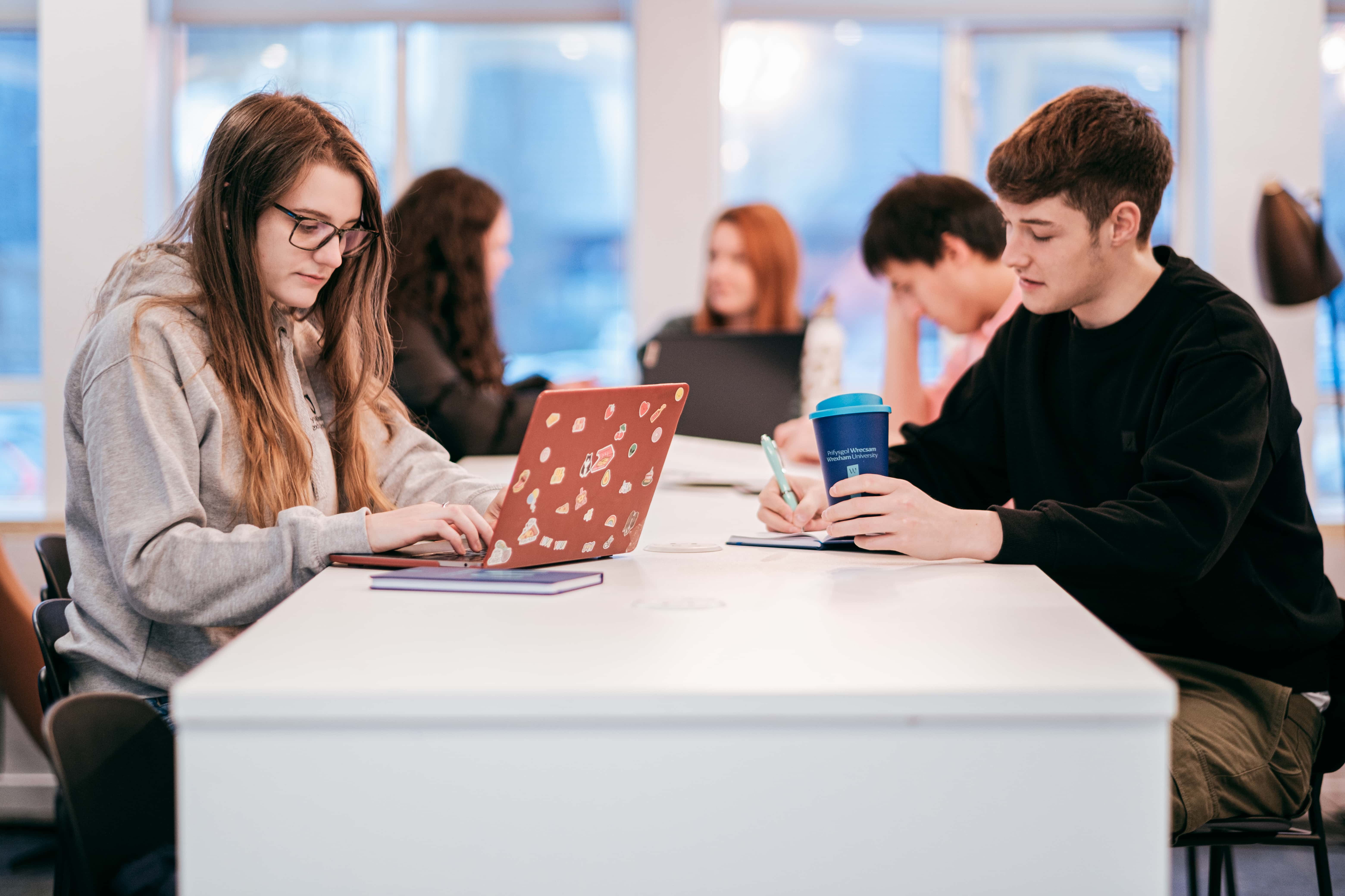 Group of students studying on our Wrexham campus