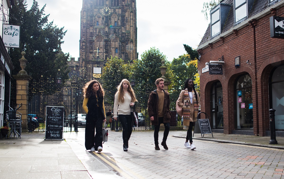 Students walking past St Giles Church
