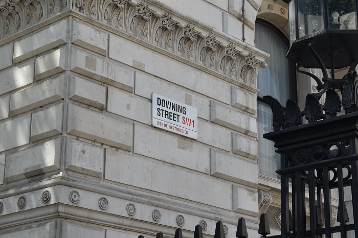10 downing street sign on wall