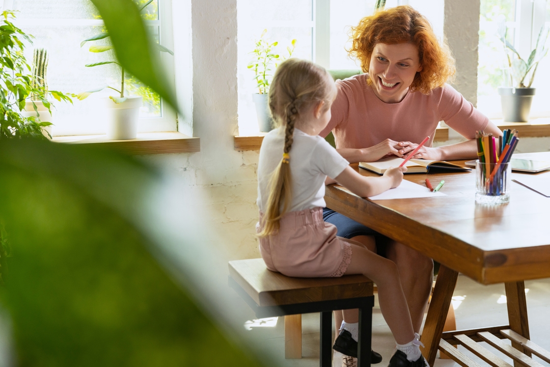 Teacher sitting with a child